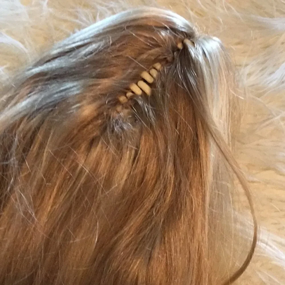 Synthetic ponytail hair piece blondish colors clip on to your hair for length